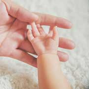 saving money for a baby, baby hand